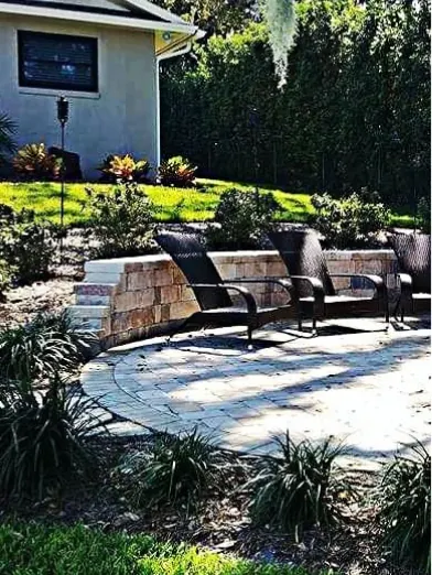 Backyard paver patio with seating and new landscaping