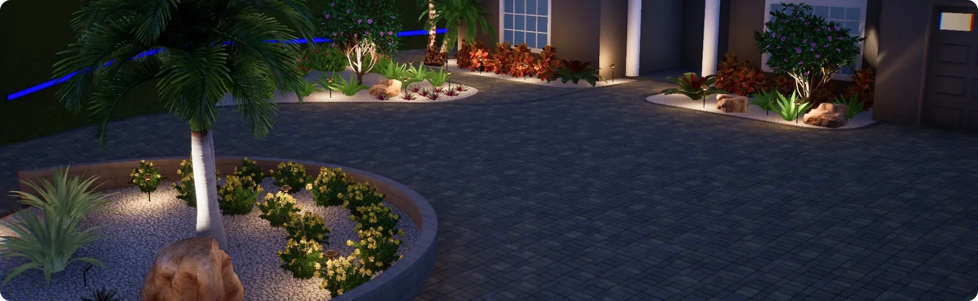 Landscape lighting along a paver drive at night